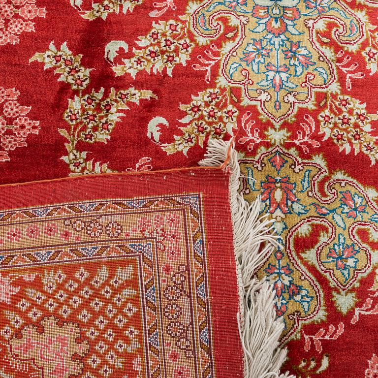 An old silk signed Ghom carpet ca 199 x 129 cm.