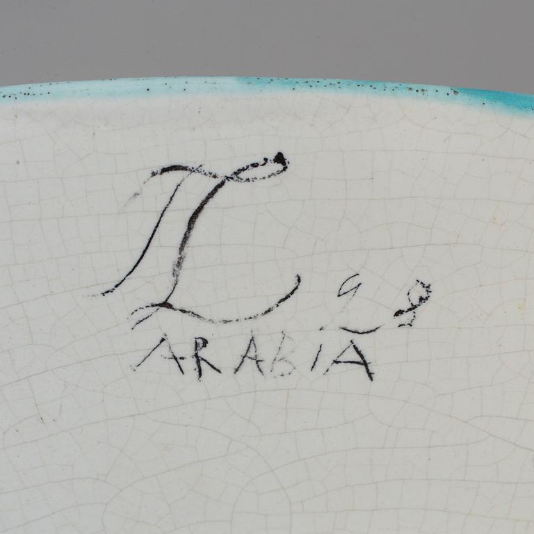 A earthen ware charger by Tyra Lundgren, signed and dated 28, Arabia, Finland.