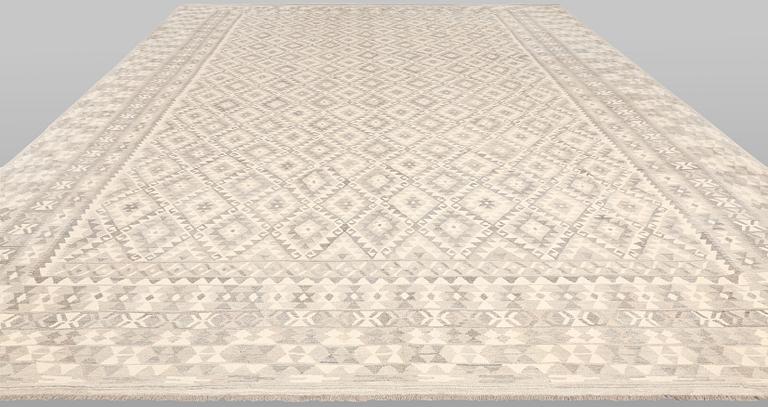 A Kilim carpet, approx. 590 x 407 cm.