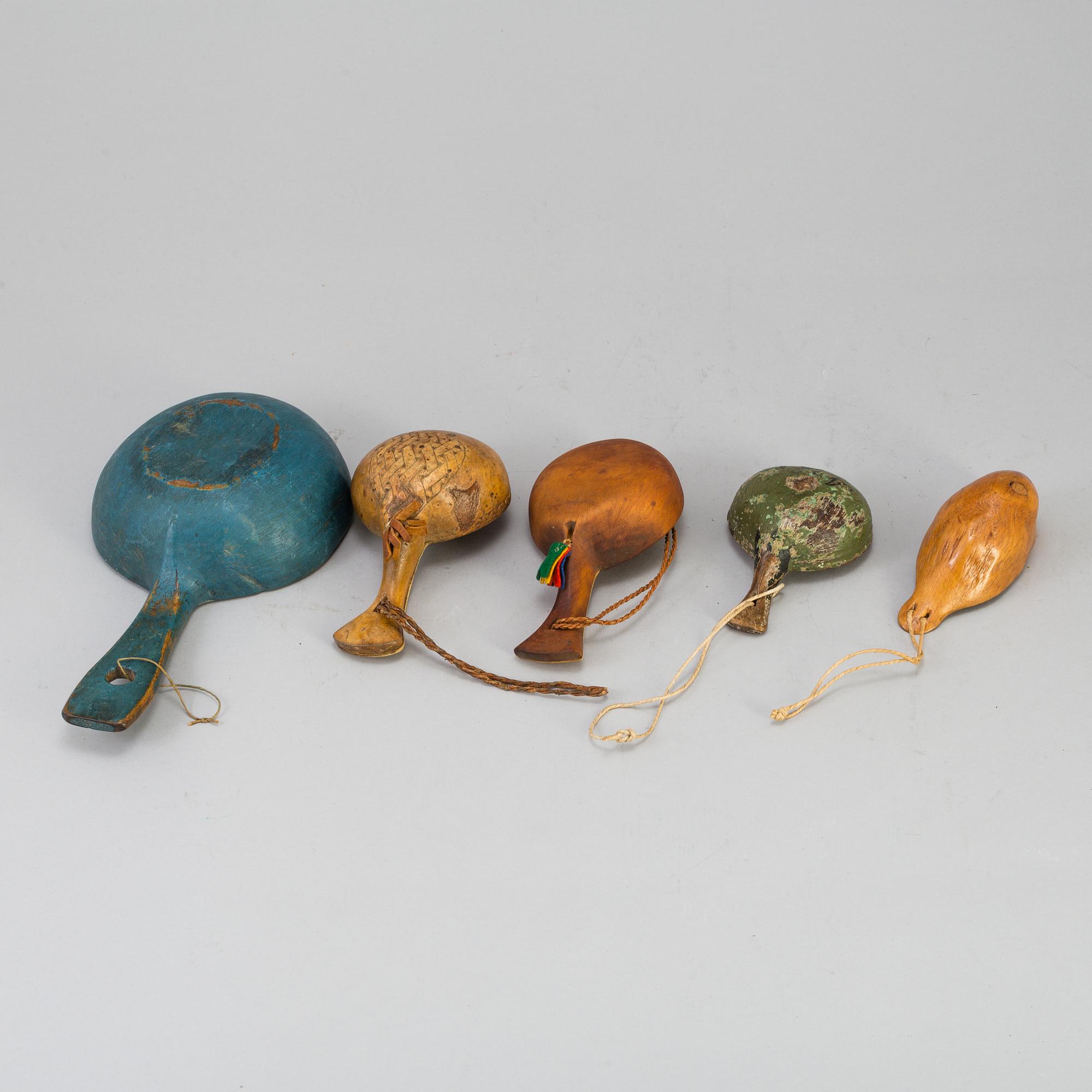 A set of five amongst others Sami cups made of birchwood and reindeer antlers.