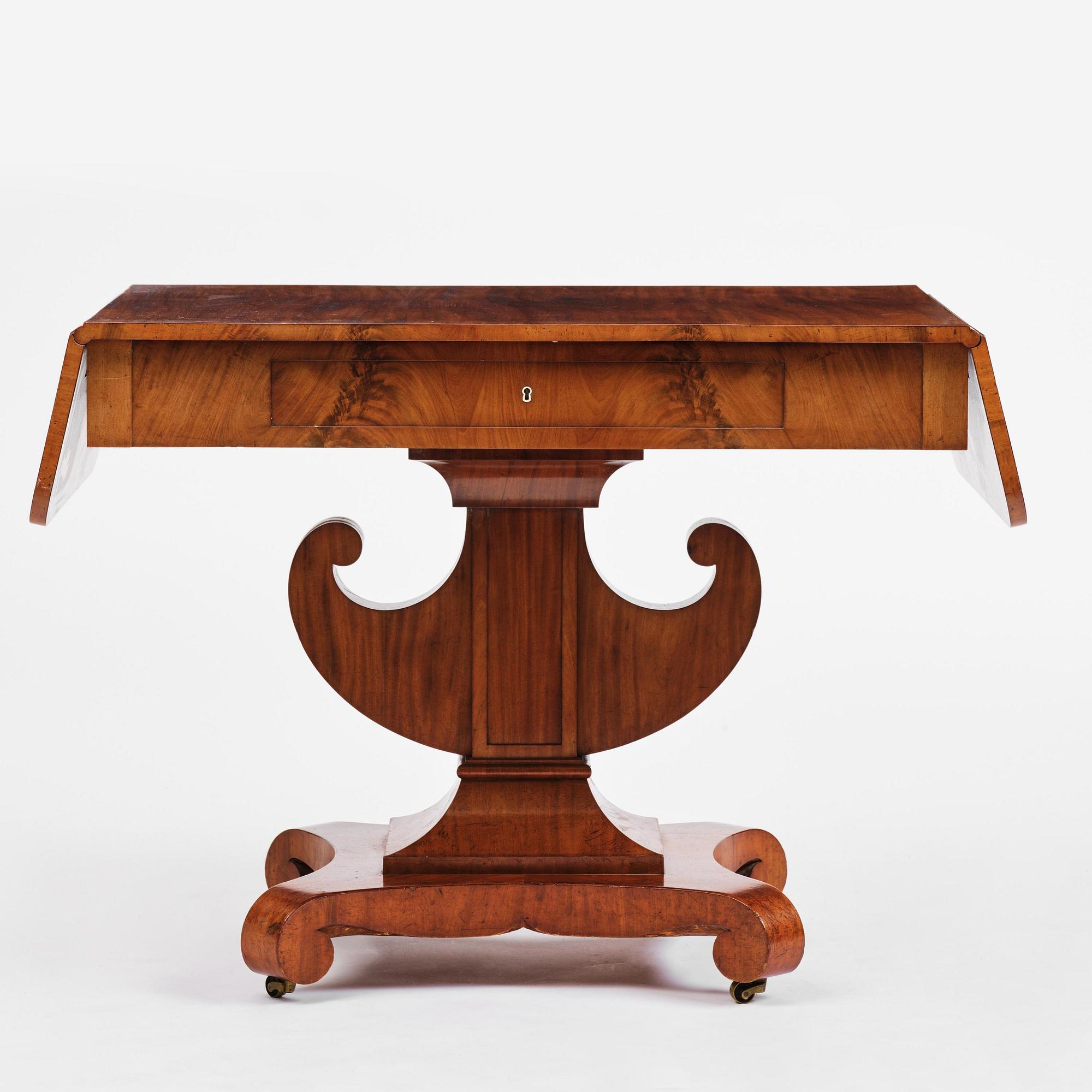 A Swedish Empire mahogany center table.