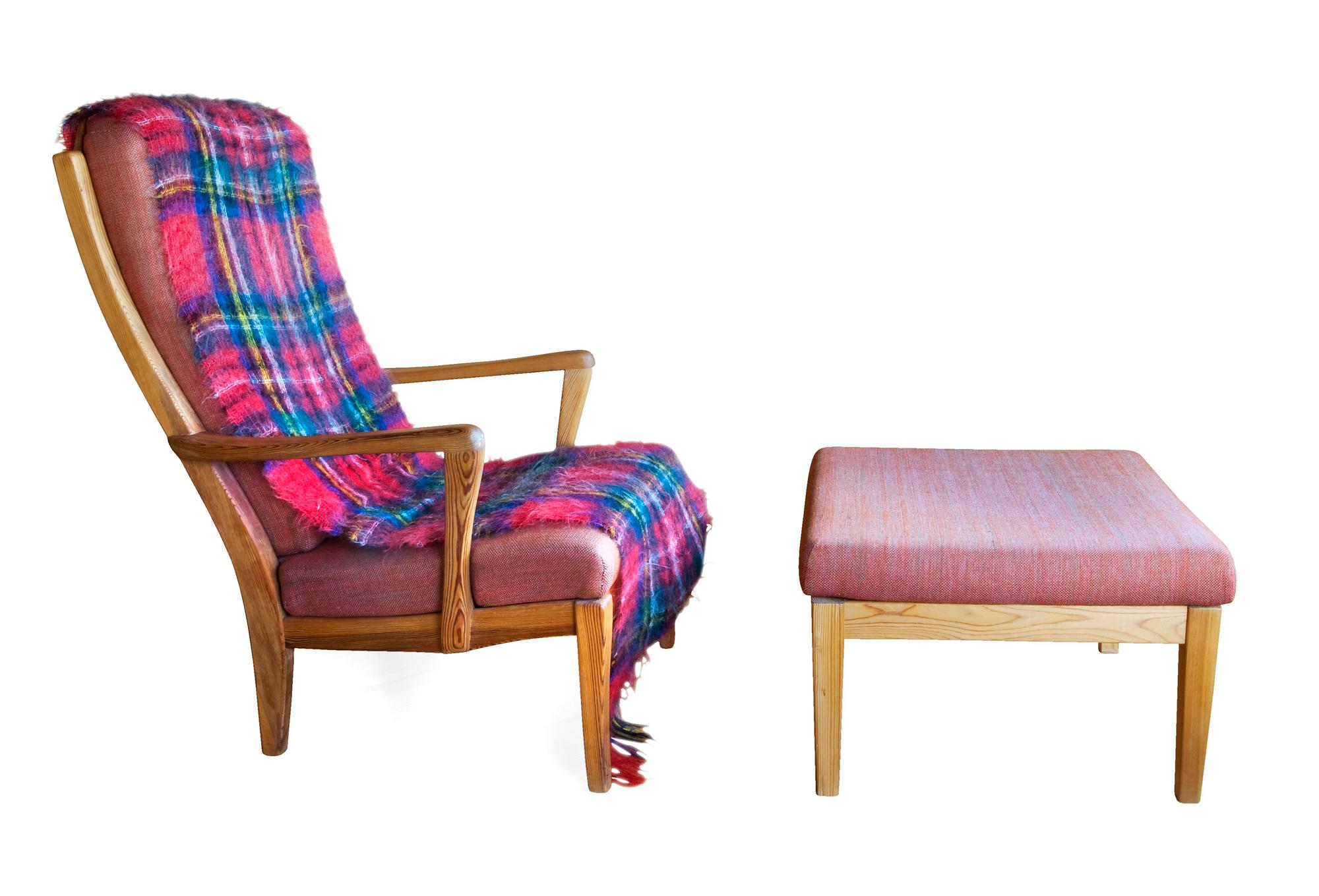 A PINE ARMCHAIR WITH OTTOMAN,