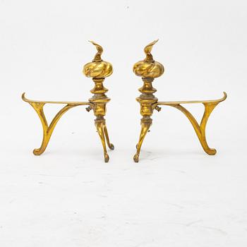 A four piece brass fire set, early 20th Century.