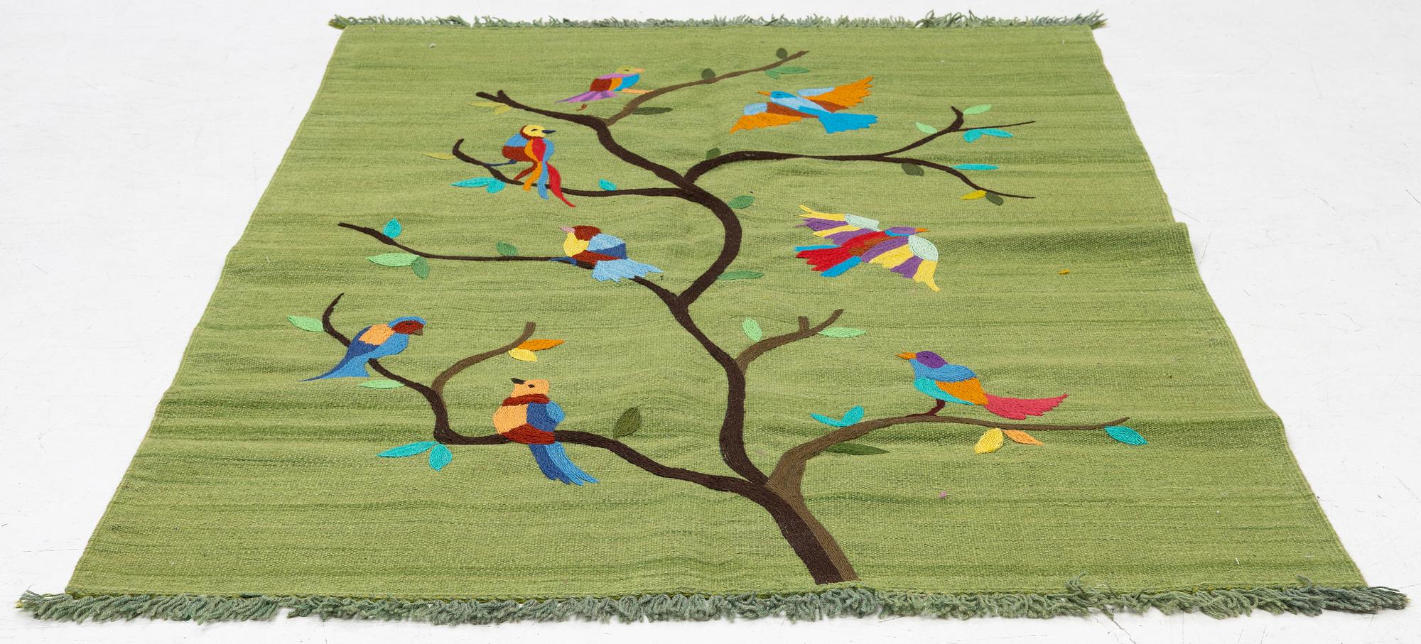 A hand-embroidered Kelim rug, 184 x 124 cm.