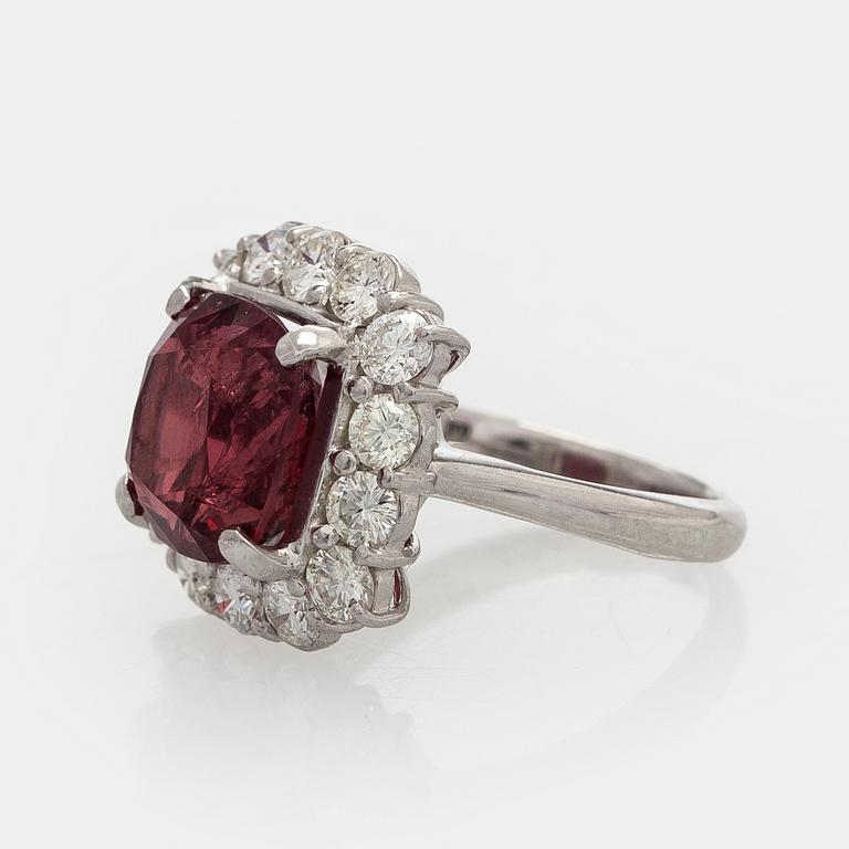 A platinum ring with spinel and brilliant cut diamonds.