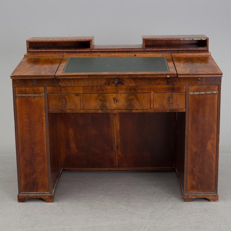 A mid 19th century writing desk and chair.