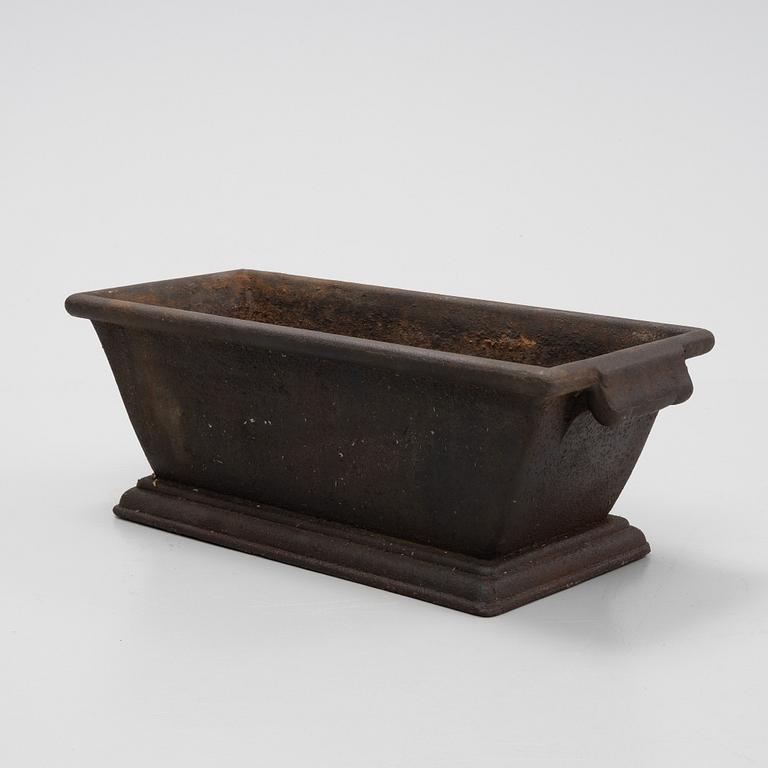 A cast iron plant pot, 20th Century.