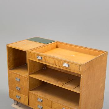 KÖPMANNADISK, 1900-talets mitt.