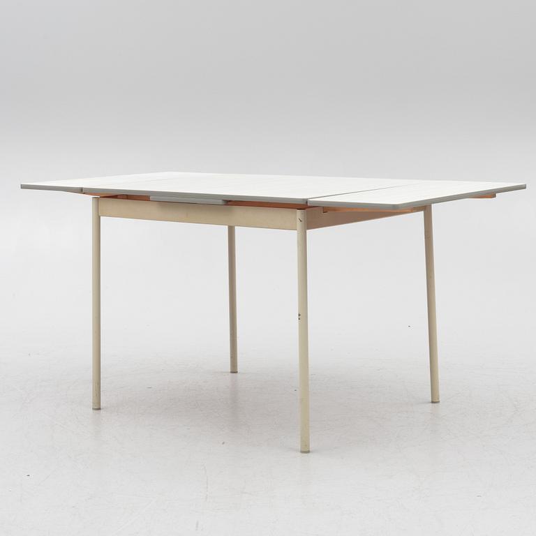 A table and four chairs, mid-20th Century.