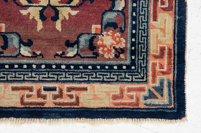 A Chinese rug, semi-antique/antique, 129 x 67 cm.