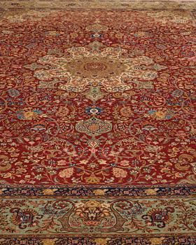 A CARPET, a semi-antique Tabriz, ca 339 x 253,5 cm.