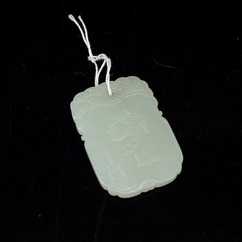 A carved nephrite pendant, 20th Century.