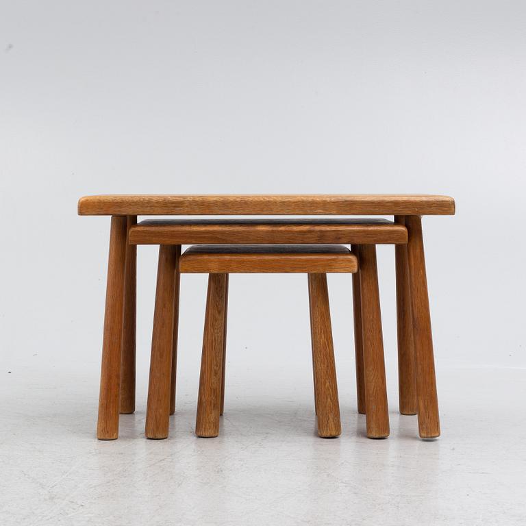 A set of three nesting oak tables or stools. second paert of the 20th century.