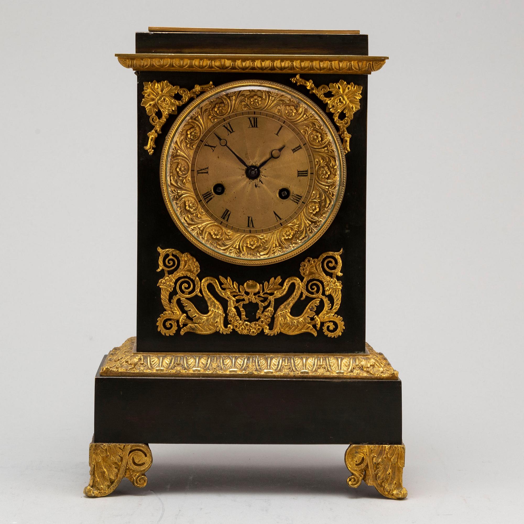 An Empire-style late 19th century mantel clock.