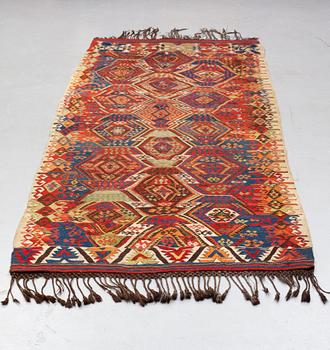 A carpet, antique/semi-antique Anatolian kilim, ca 292-301 x 125-135 cm.