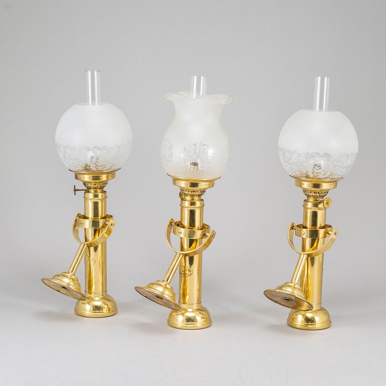 A set of three brass kerosene lamps GV Harnisch Denmark later part of the 20th century.