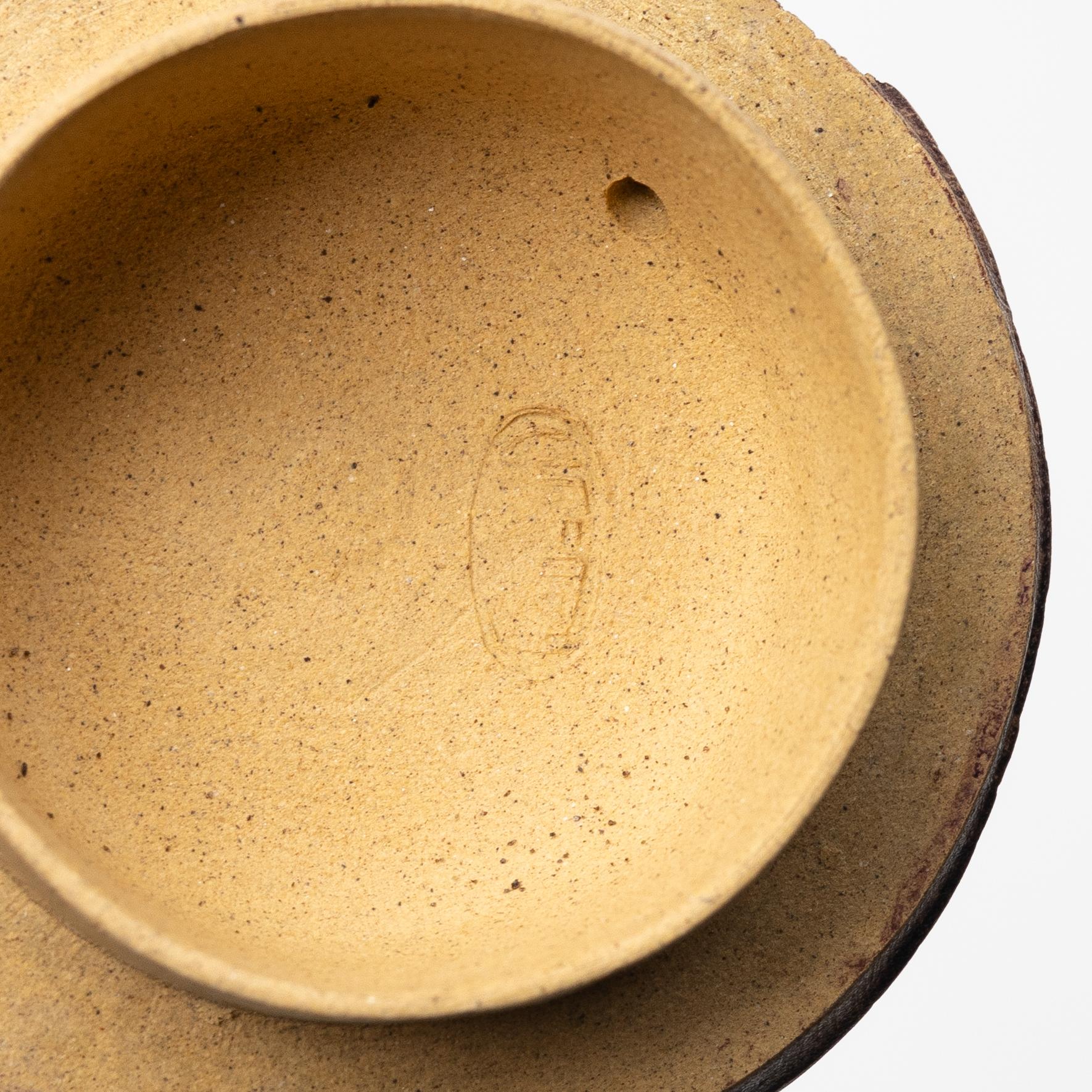 A group of three bright yellow yixing 'Gongfu' teapots, China, 1990s.