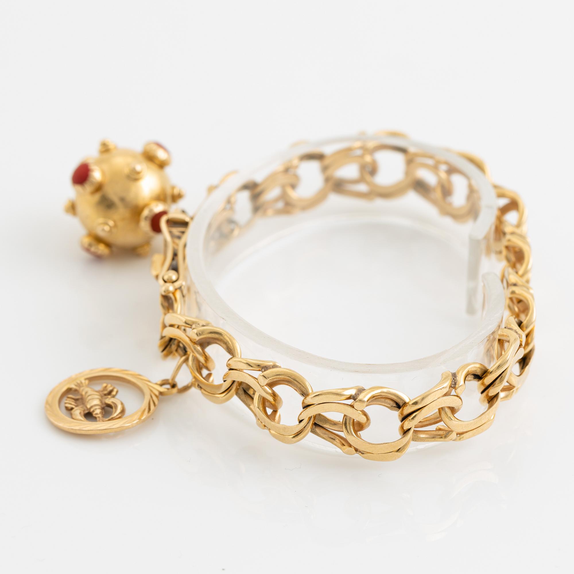 Gold charm bracelet.