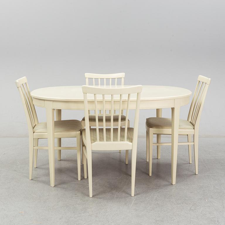 A dining table with six chairs by Carl Malmsten. Second half of the 20th Century.