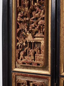 A set of four framed wooden panels, Qing dynasty, 19th Century.