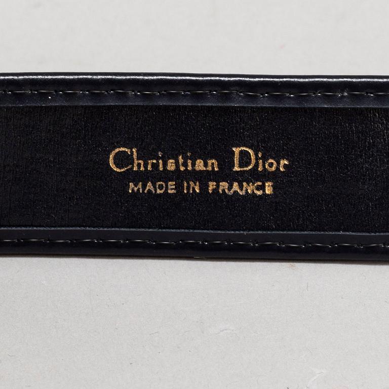 CHRISTIAN DIOR, a set of a clutch, a belt and an umbrella.