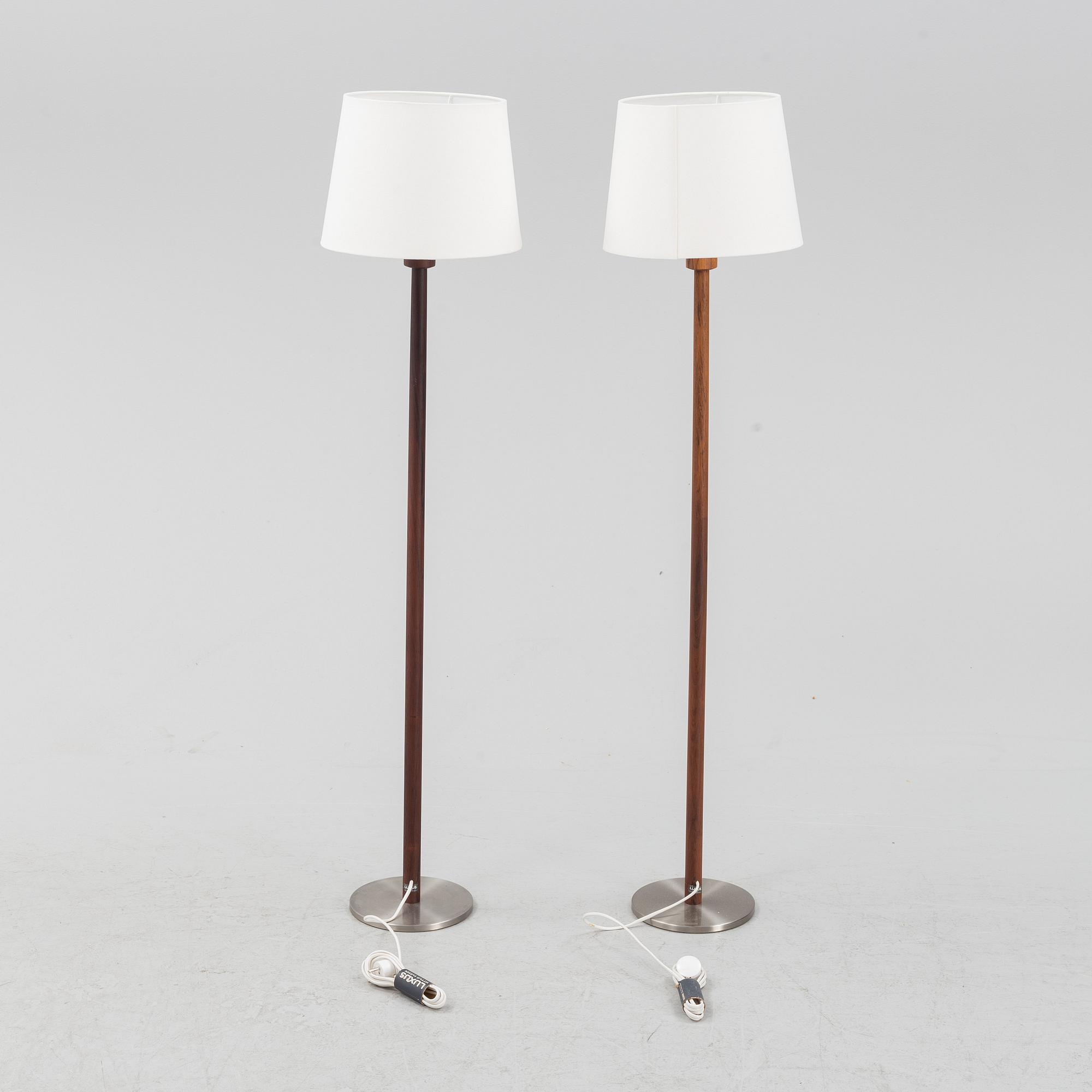Uno & Östen Kristiansson, a pair of rosewood veneered floor lights, Luxus, Vittsjö, 1960's.
