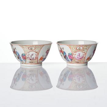 A pair of famille rose 'figural' tea cups with saucers, Qing dynasty, Qianlong (1736-95).