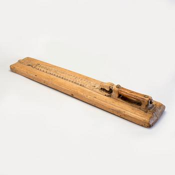 A Swedish folk art mangle board with carved decorationd, owners' initials and the date 1744.