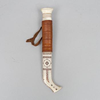 Esse Poggats, a reindeer horn knife, signed.