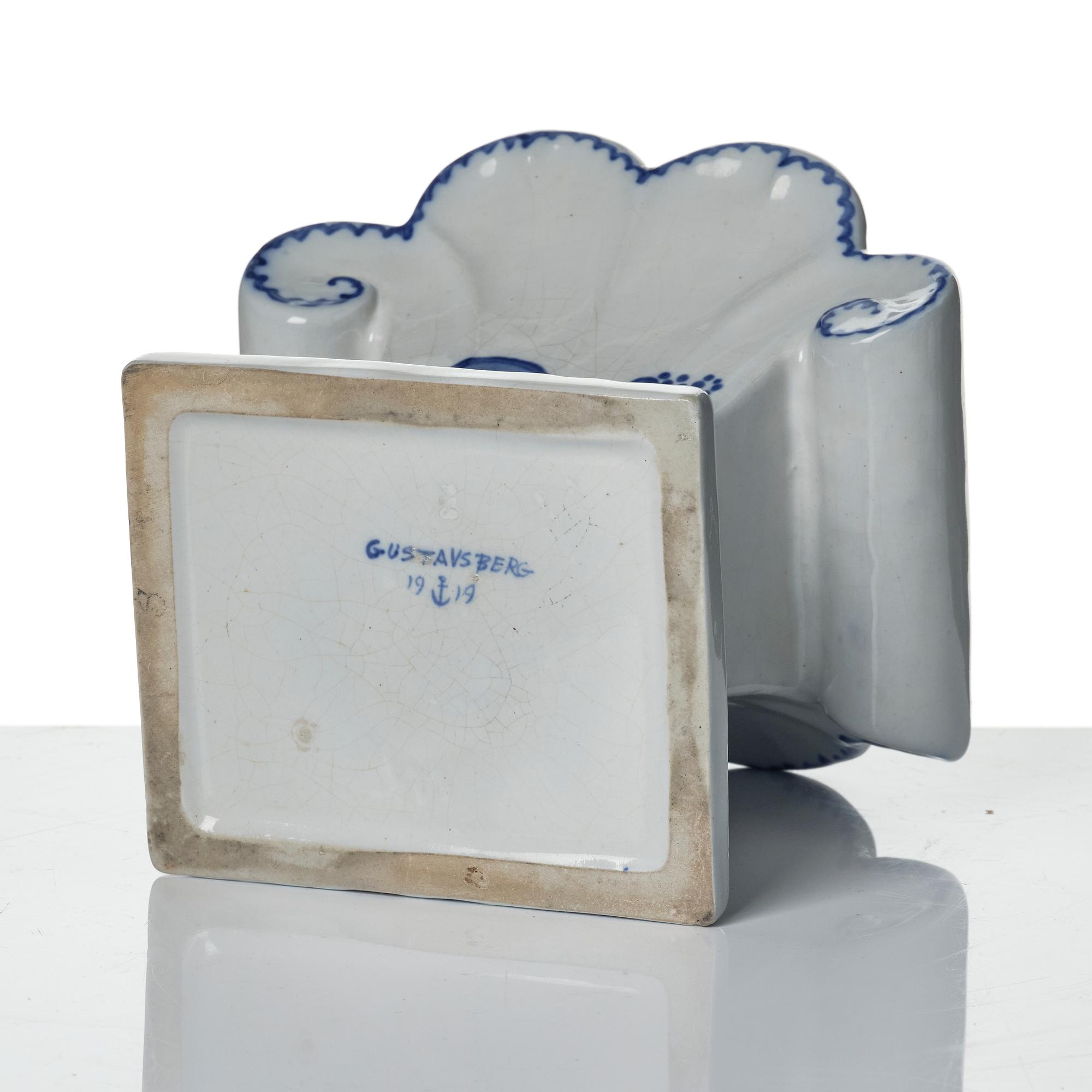 Wilhelm Kåge, eleven pieces of faience including jars, inkwells and a tulip vase, Gustavsberg, Sweden, 1919-1920.
