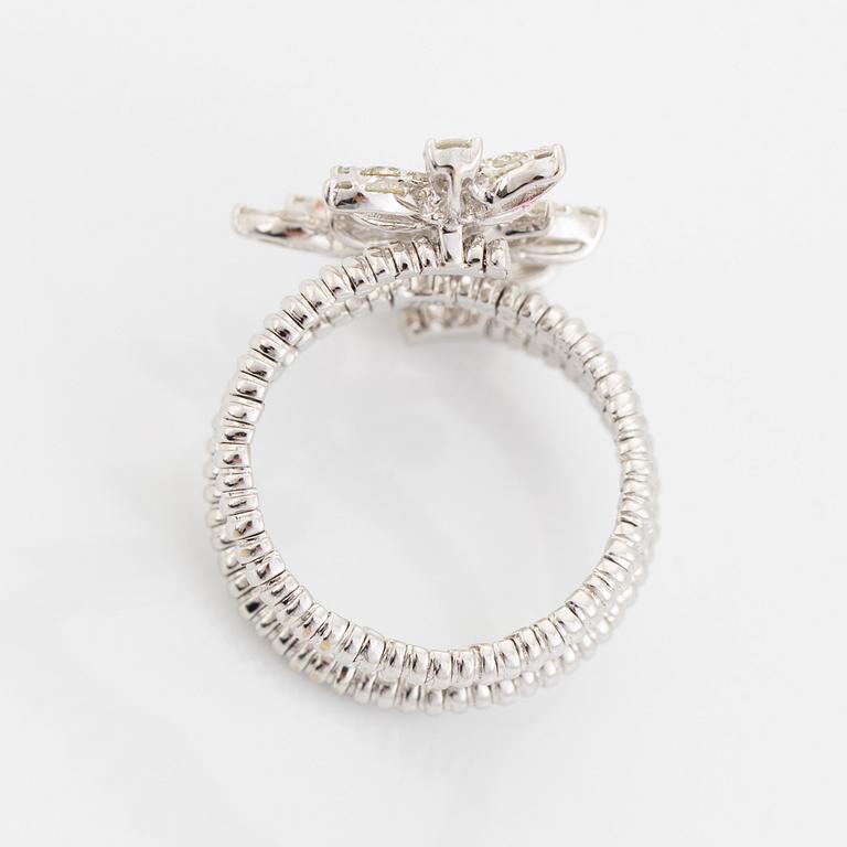 Brilliant cut diamond cross over flower ring.