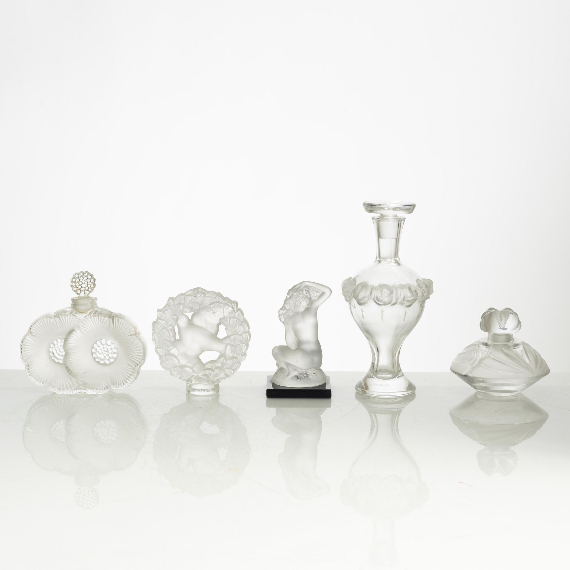Lalique, four perfume bottles and five figurines, France, after 1945.