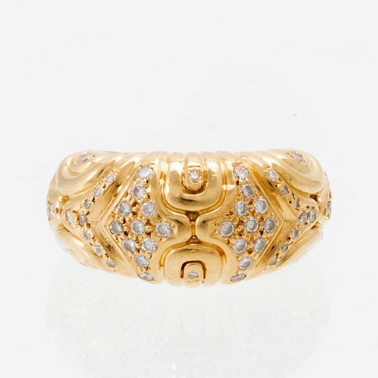 An 18K gold ring set with round brilliant-cut diamonds, London.