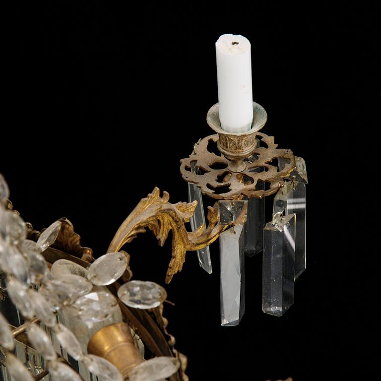 An Oscarian gilt brass eight-light chandelier.
