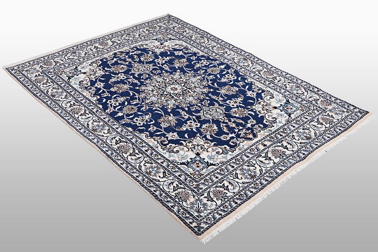 A carpet, Nain, part silk, ca 202 x 148 cm.