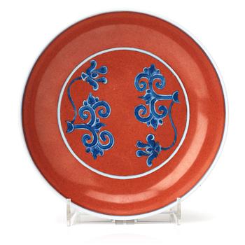 552. A red glazed dish, 17th Century with Chenghua mark.