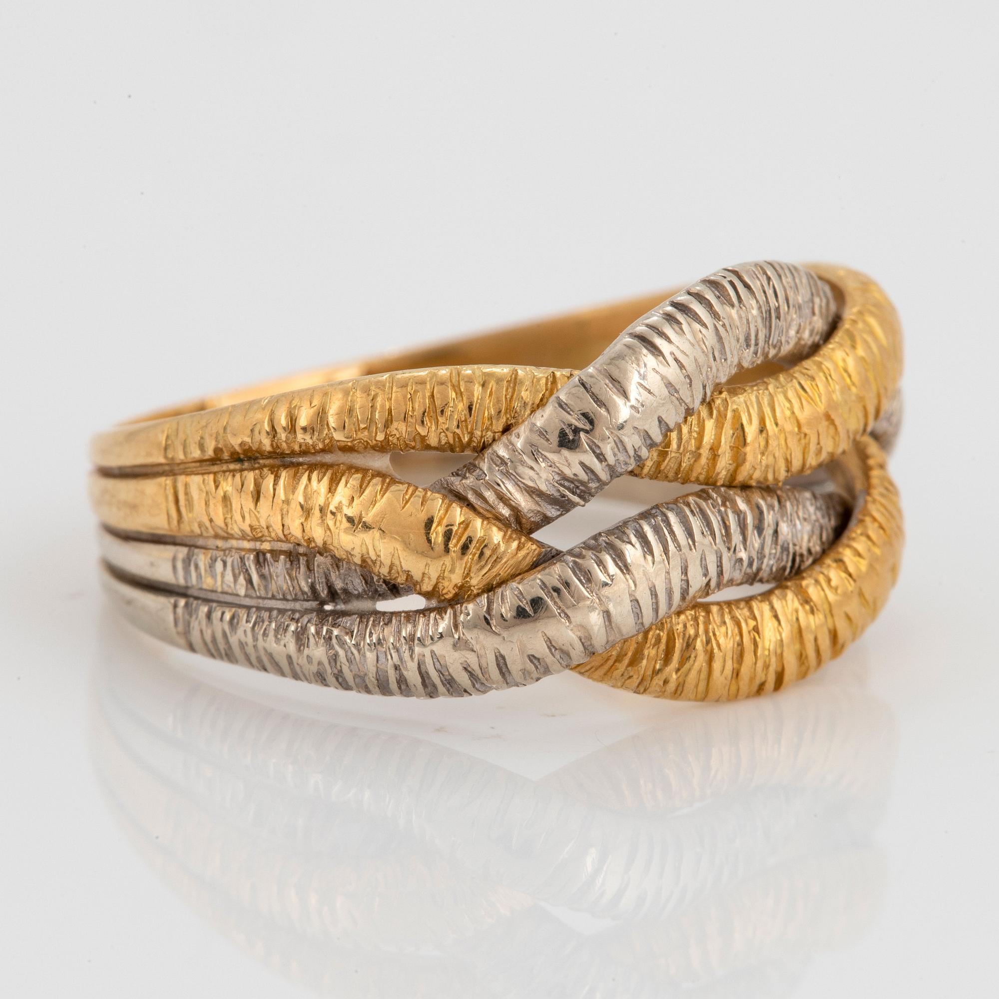 An 18K gold and white gold ring.