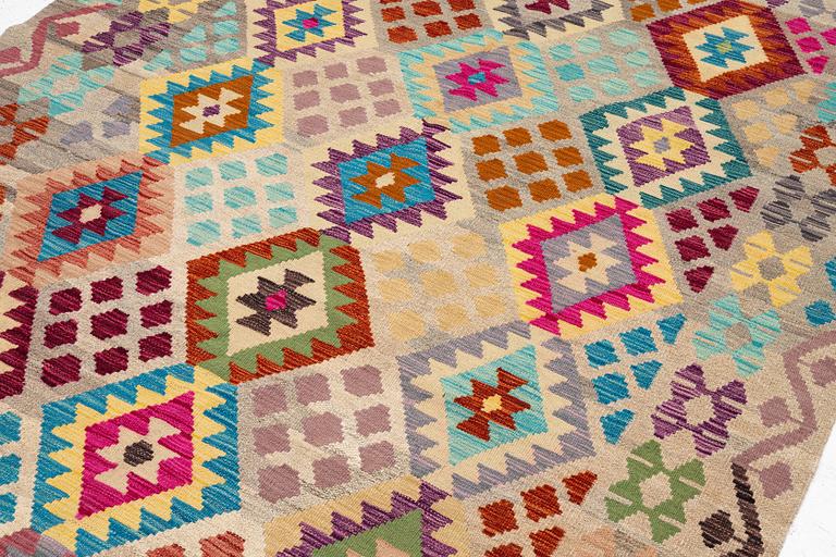 A Kelim rug, c. 252 x 180 cm.