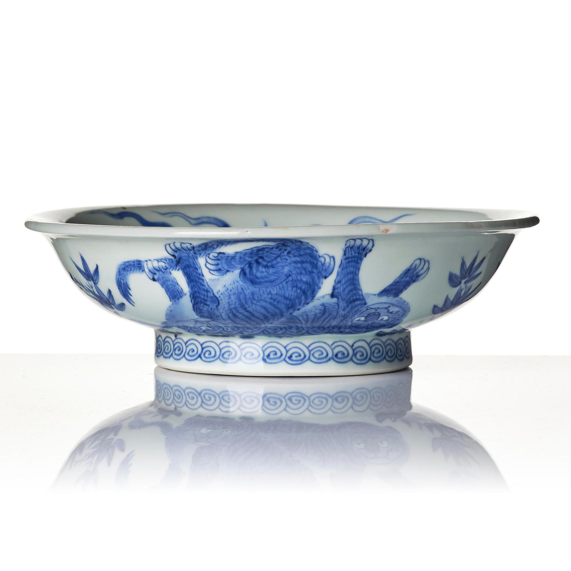 A rare Japanese Hirado ware dish with dragon and tigers, 19th century.
