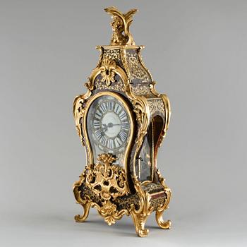 A 19th century mantle clock in the style of Louis XV.