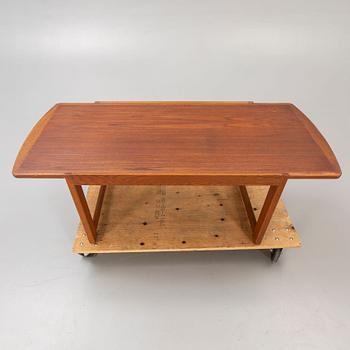 A 1960s, probably Danish teak and oak coffee table.
