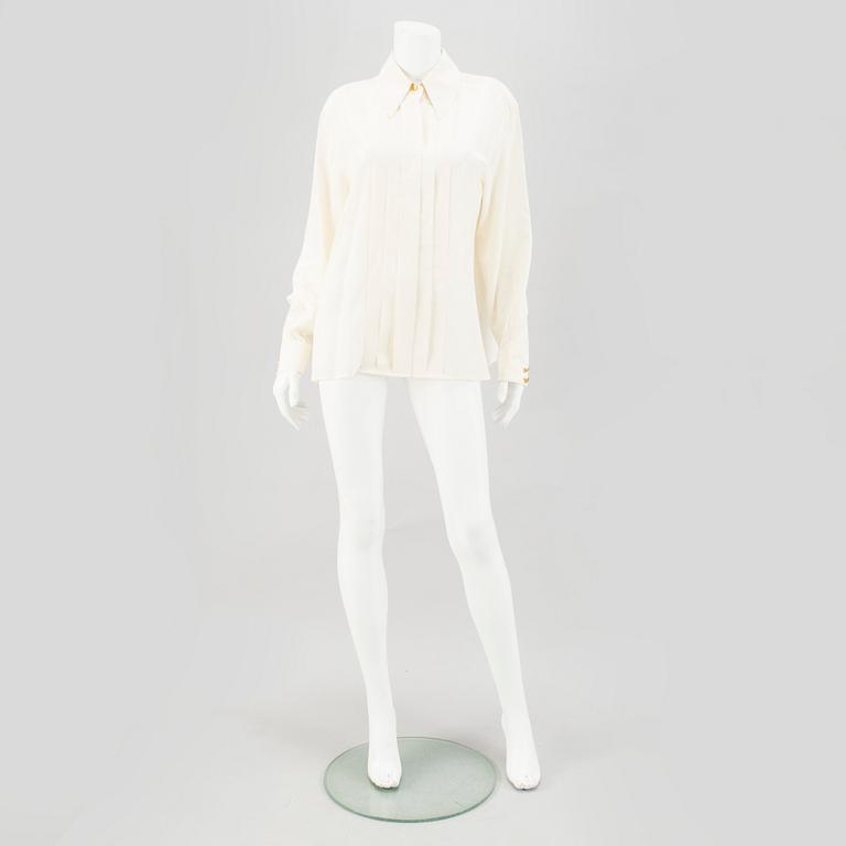 A Crepe de Chine Cream Coloured Silk Blouse by Chanel.