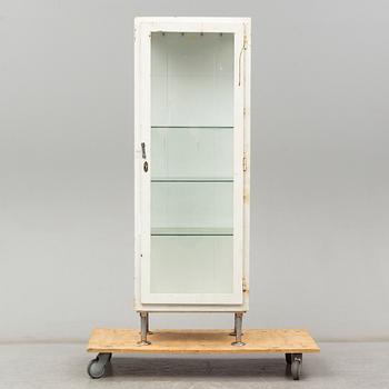 A metal doctor's cabinet, mid 20th century.