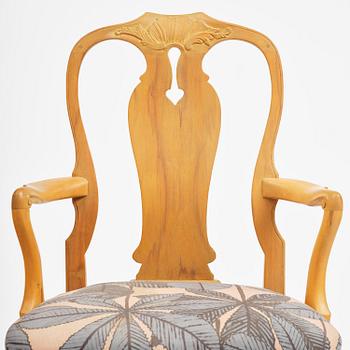 A pair of rococo open-back armchairs, Stockholm, later part 18th century.