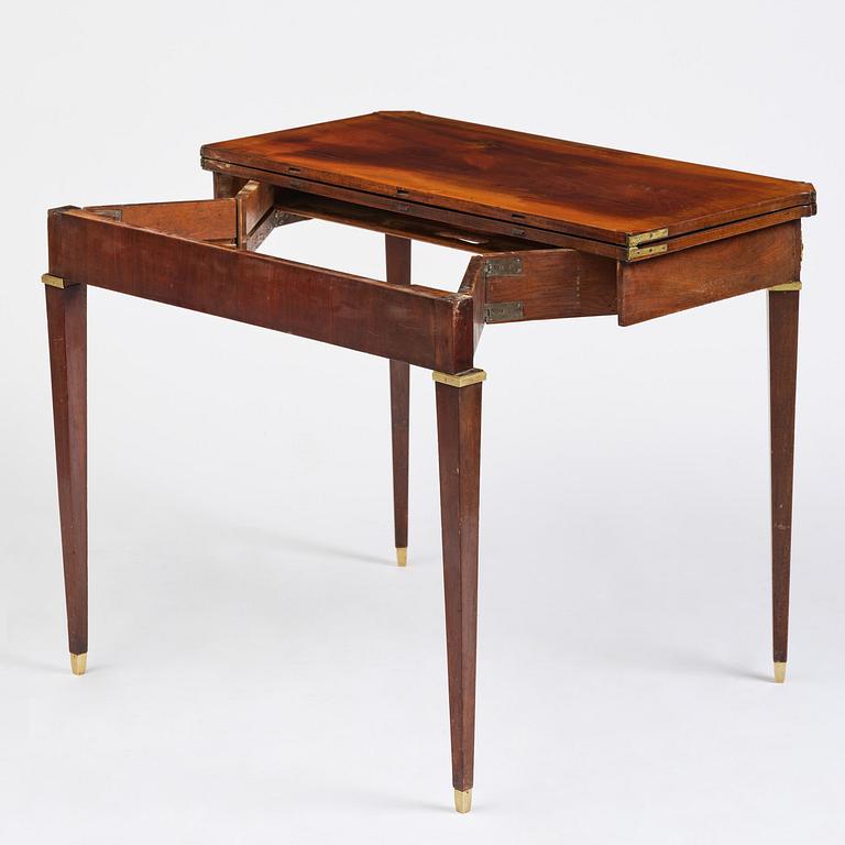 A Gustavian 'concertina action' mahogany games table by Georg Haupt (master in Stockholm 1770-84).