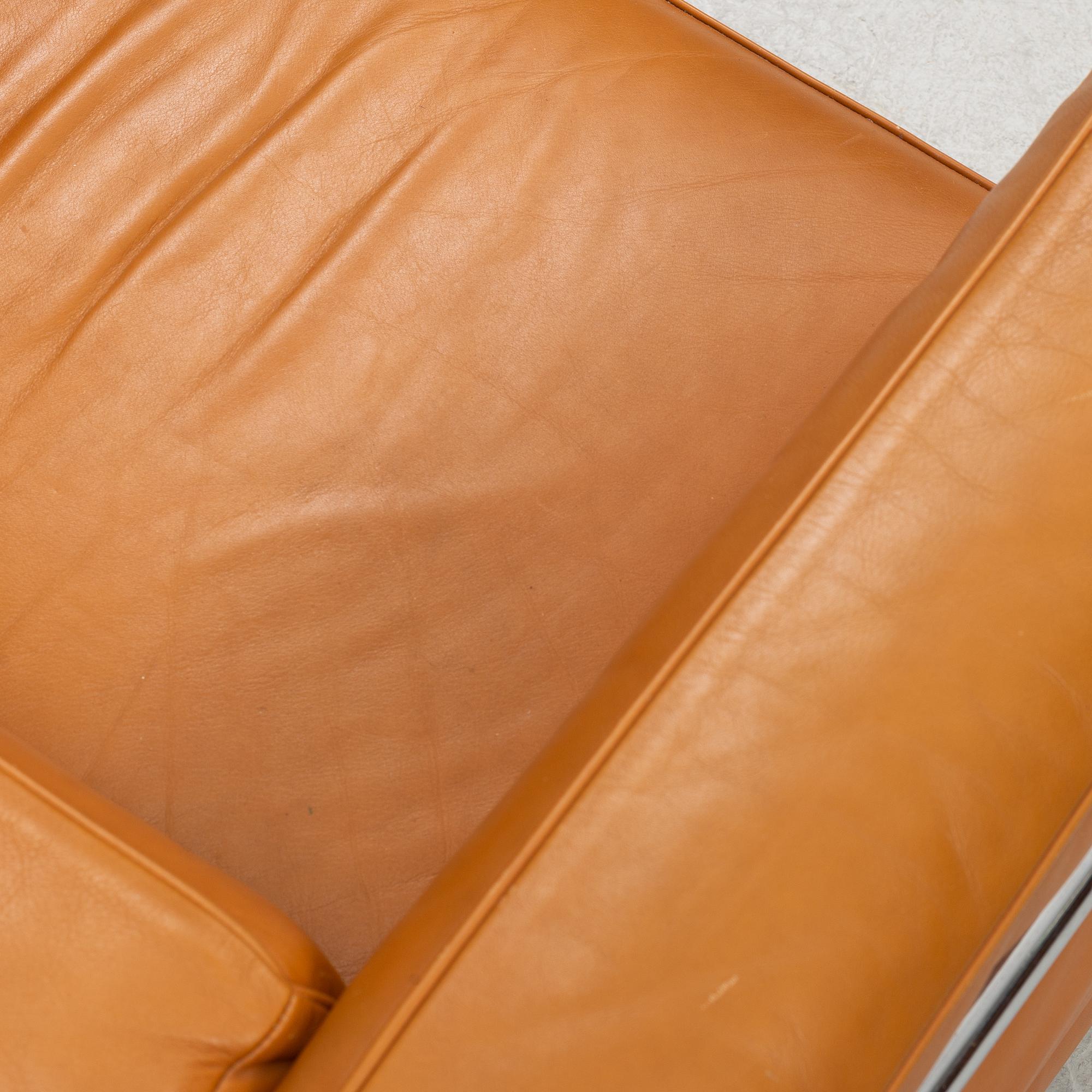 A LC2 lounge chair by Le Corbusier, Pierre Jeanneret & Charlotte Perriand for Cassina.