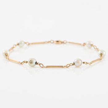 Armband, 18K guld med pärlor.