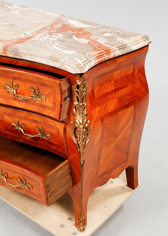 A rococo style chest of drawers, around the mid 20th century.