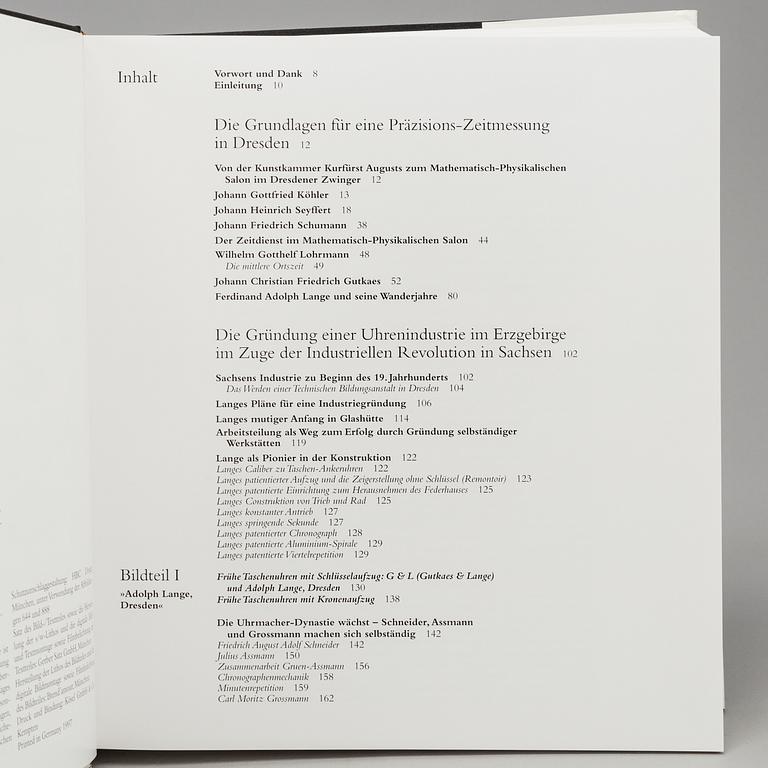 A set of 6 watch books.