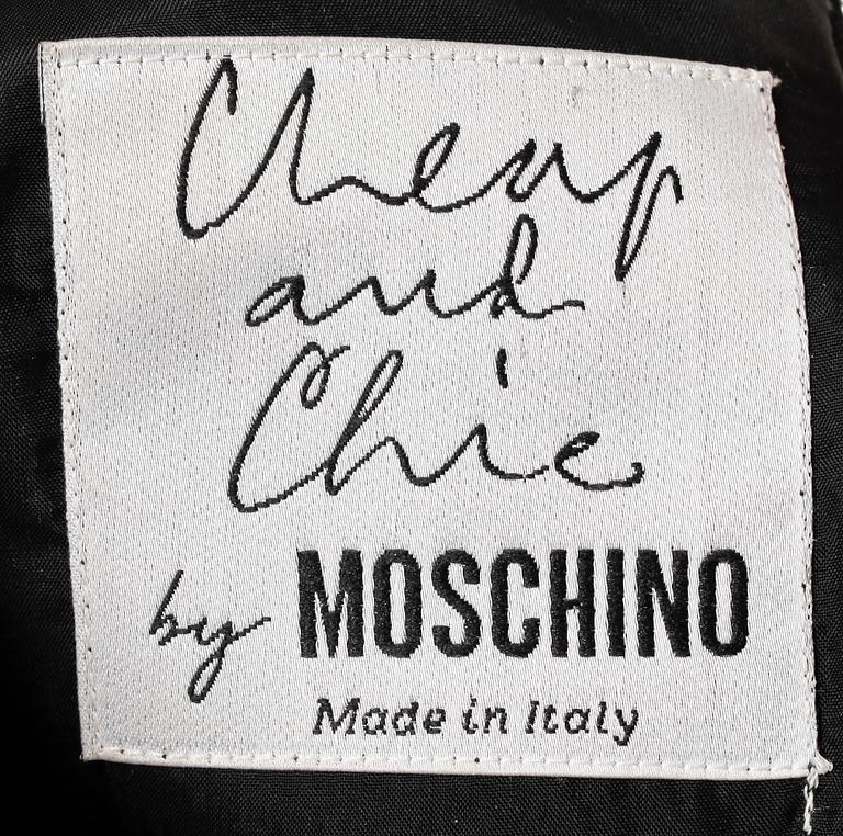 CHEAP AND CHIC BY MOSCHINO, a black cocktail dress.